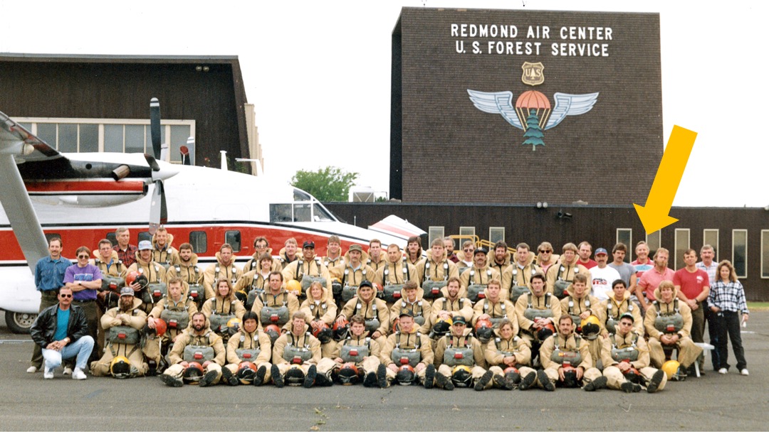 Redmond smokejumpers in front of an aircraft.