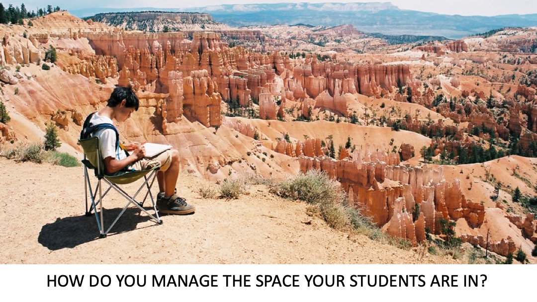 Student writing on the edge of a canyon.